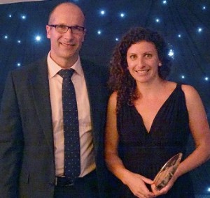Peter Riddell, TurksLegal Managing Partner, Melbourne, presents Lara Neate, Claims Consultant, BTFG with her award
