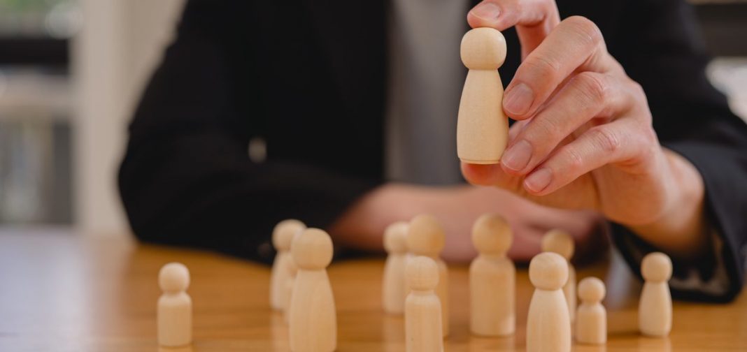 Customer Relationship Management, Executive's select Human Resource Businessman with wooden people ai working together or Hr choosing people with ai knowledge,Using AI technology in HR concept